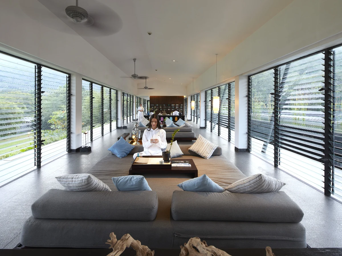 Counselor and Ayurvedic doctor collaborating on personalized treatment plan.