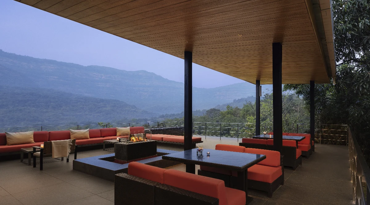 Library lounge overlooking Sahyadri mountain valleys.