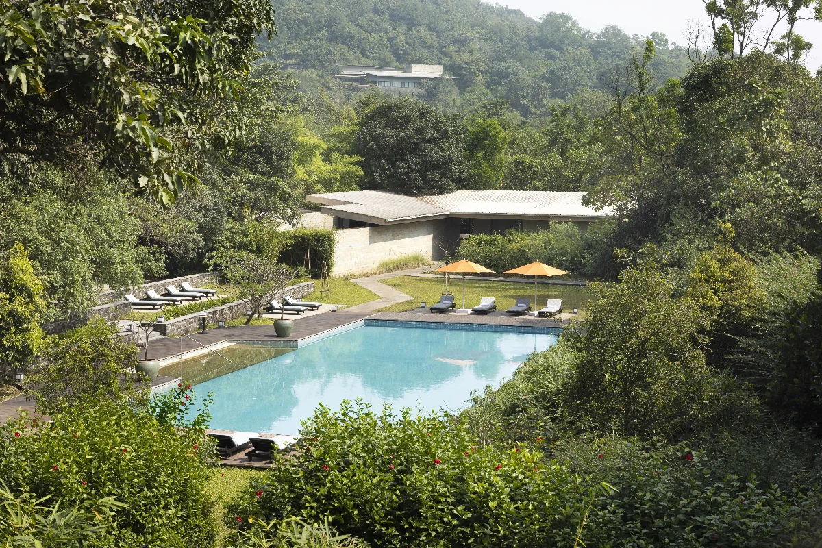 Panoramic view of luxury villa overlooking Sahyadri mountains and Shillim valley landscape.