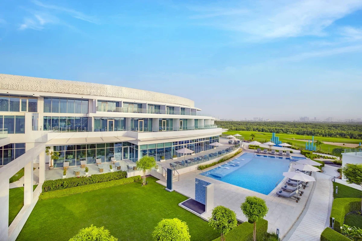 Aerial view of resort surrounded by lush mangrove forest.