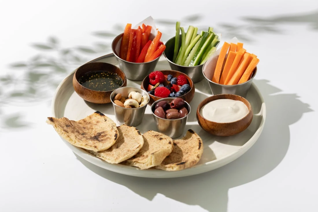 Plated therapeutic vegan meal with fresh seasonal ingredients.